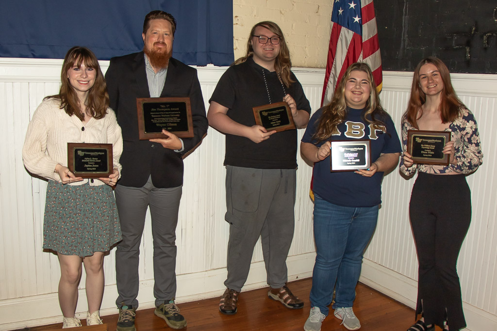 Tennessee Wesleyan students holding their awards at Honors Day