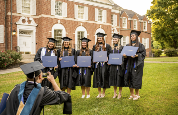 newly grads in front of lawrence hall
