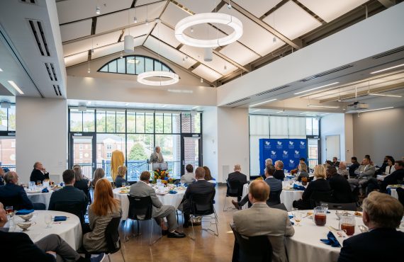 visitors in johnson event center for a luncheon